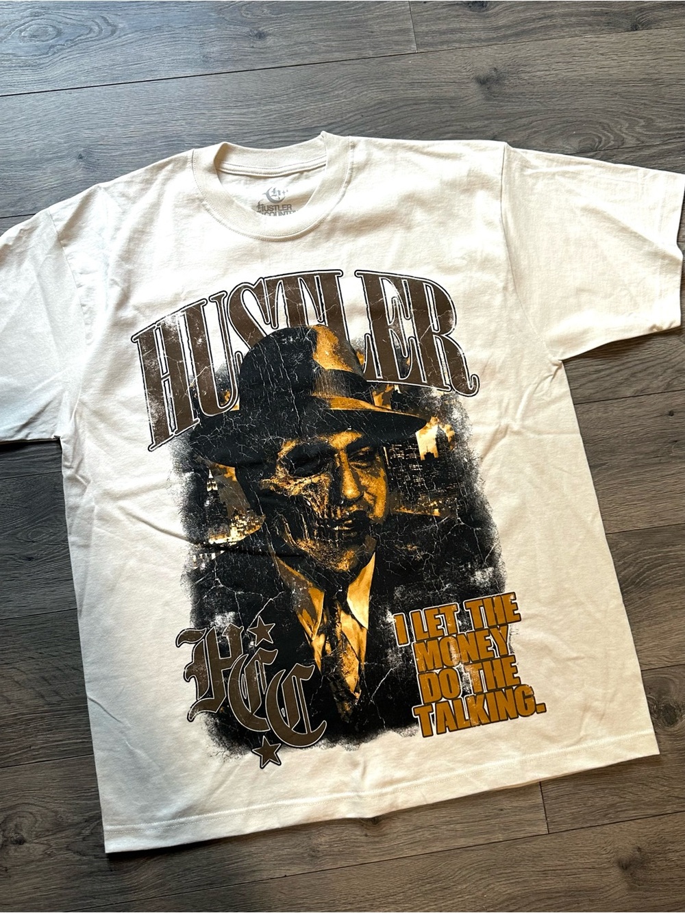 Hustler Hollywood White Tee with Black & Gold Graphic